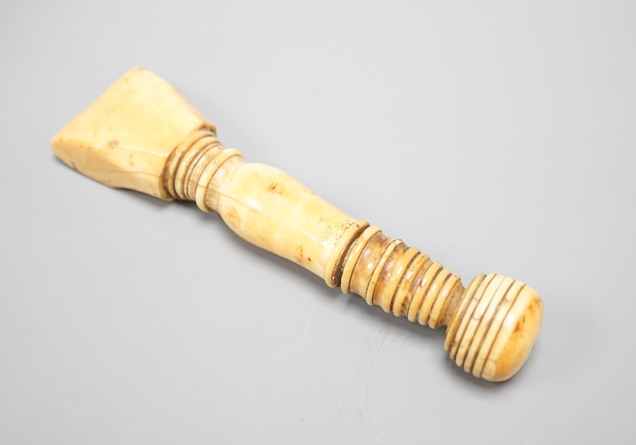 A Georgian marine ivory sail-maker's seam rubber, 13 cms long.